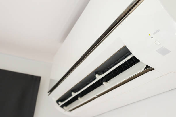 istock Air conditioner on white wall room interior background 1356078736