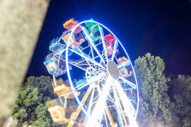 istock ferris wheel lights at state fair at night 1356083289