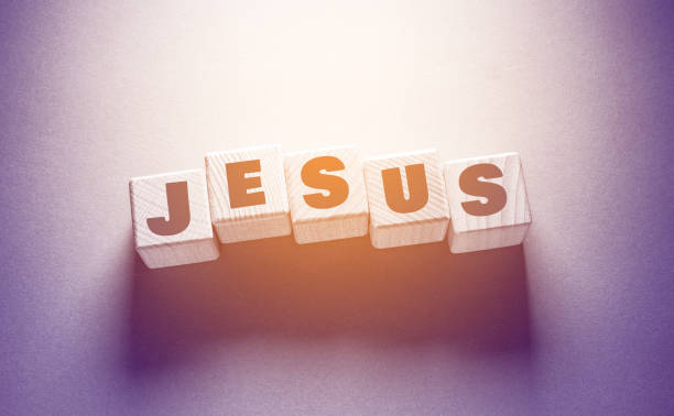 istock Jesus Word with Wooden Cubes 1356085630