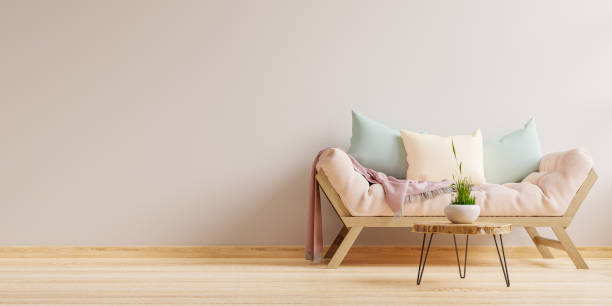 istock Empty living room with sofa and table on empty white wall background. 1356087495