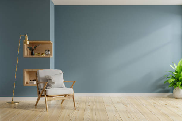 istock Living room interior with armchair on empty dark blue wall background. 1356087510