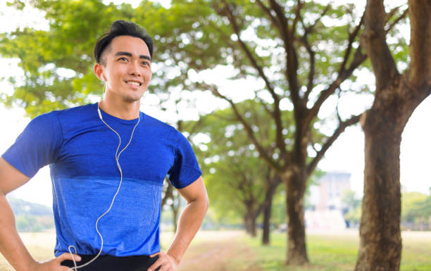 istock Fittness Young man jogging in the city park 1356087521