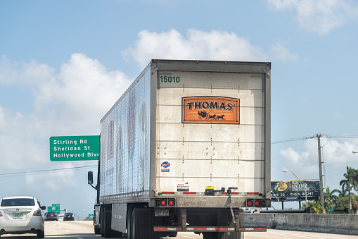 Fort Lauderdale, USA - July 8, 2021: Delivery truck vehicle car delivering Thomas' english muffins baking bread products in Florida on road highway