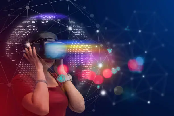 Young girl play VR virtual reality goggle and experiences of metaverse virtual world on colorful. Visualization and simulation, 3D, AR, VR, Innovation of futuristic, Metaverse Technology concepts.