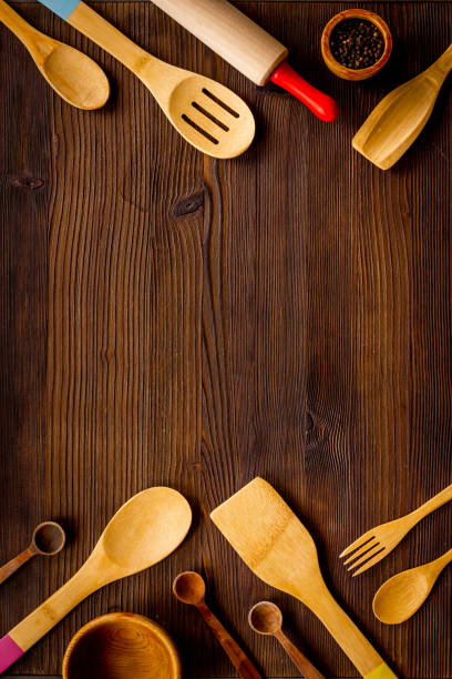 istock Flat lay of wooden kitchen utensils and cookware 1356097301