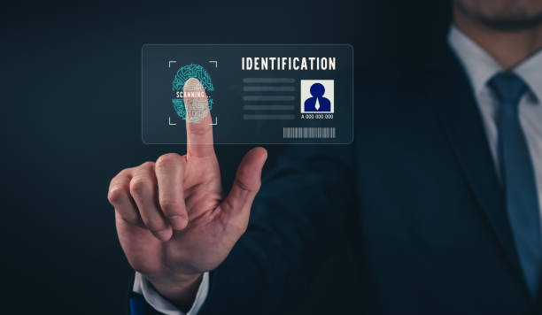 istock Businessman wearing black suit and hand touch interface scanning fingerprint to unlock, Concept security in identity technology. 1356109257