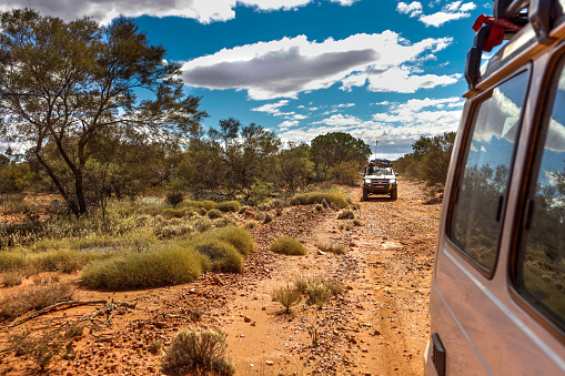 Gunbarrel Highway, Western Australia - August 16, 2010: A 4WD convoy on a rough section of the Gunbarrel highway in outback Western Australia.