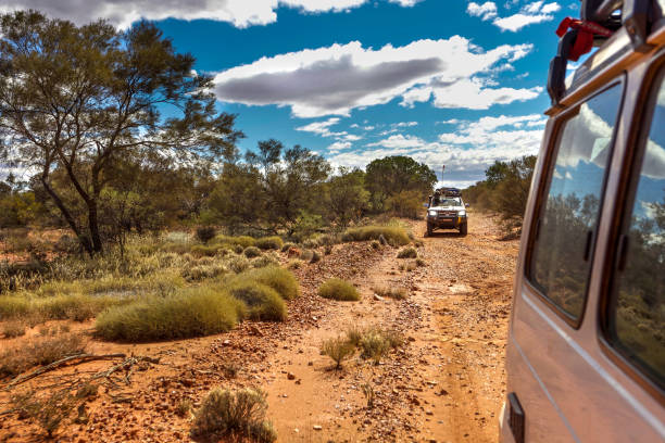 Gunbarrel highway in outback Western Australia Gunbarrel Highway, Western Australia - August 16, 2010: A 4WD convoy on a rough section of the Gunbarrel highway in outback Western Australia. western australia flag stock pictures, royalty-free photos & images