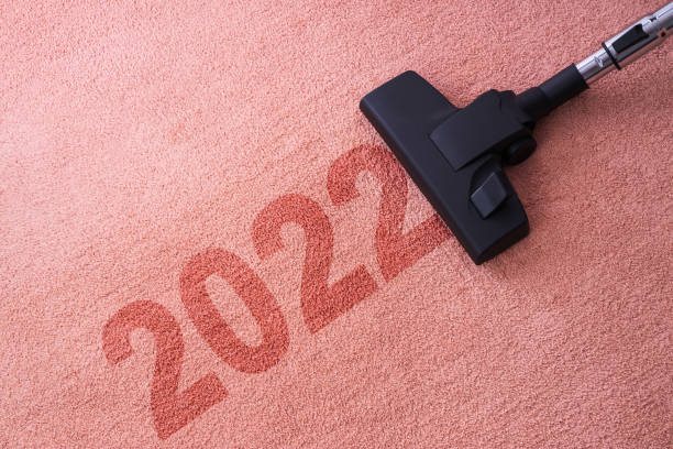 istock 2022 New year home cleaning with vacuum cleaner and copy space for a text 1356111249