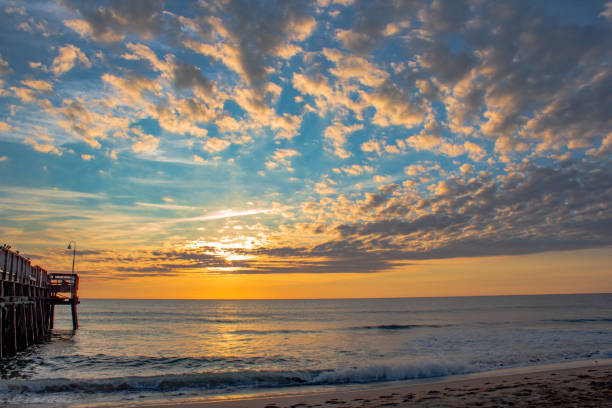 istock Sunrise at the Sandbridge beach pier 1356112243