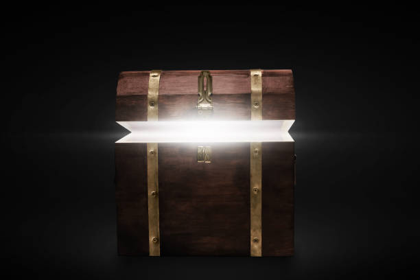 istock Wooden treasure chest on dark background 1356114825