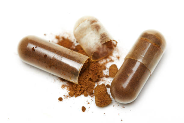 istock Herb capsule, Nutritional Supplement, Vitamin Pill, Herbal Medicine on white background 1356115676