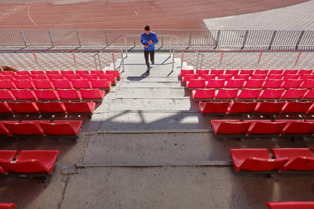 istock Man jogging at the stadium 1356118574