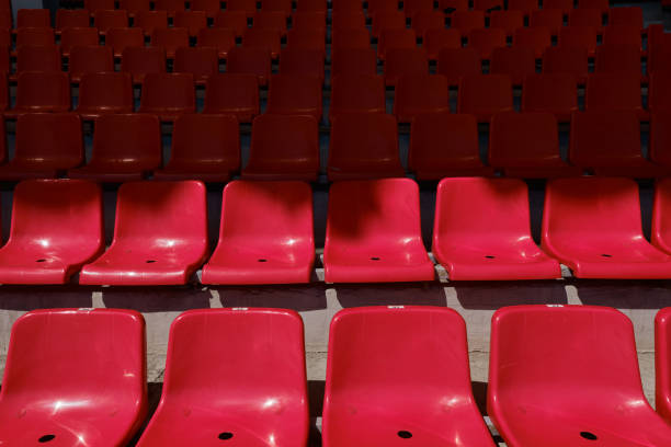 istock Empty stadium with red rows of chairs 1356119138