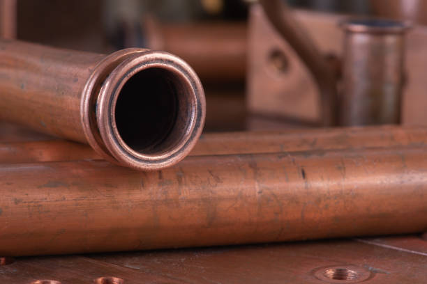 istock Copper plumbing fittings for water pipe installation 1356121226
