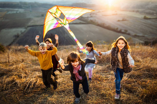 istock Playing with kite in autumn day! 1356121317