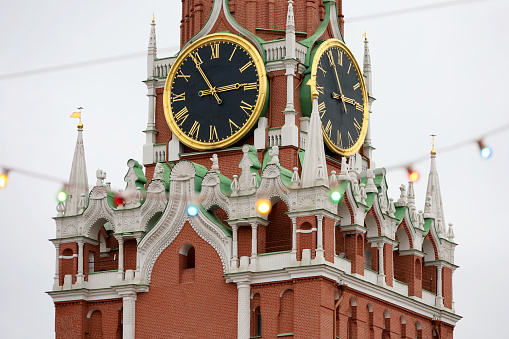 Festive lights on background of Kremlin tower