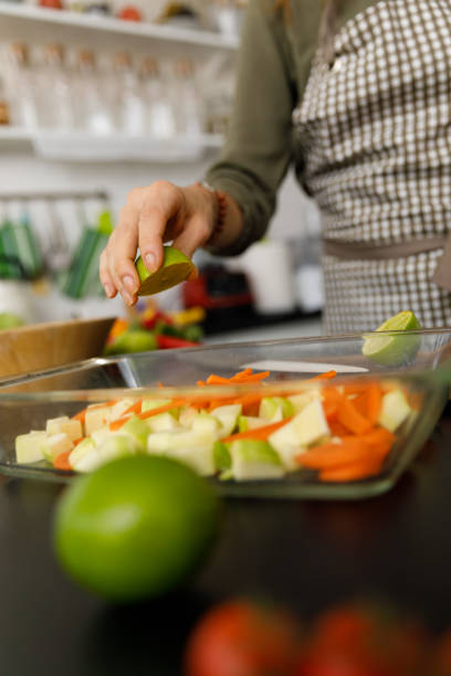 istock Adding a splash of fresh lime juice on a healthy meal 1356123783