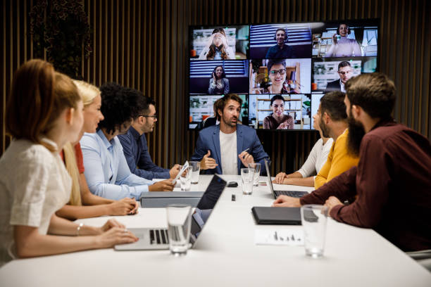 istock Manager leading a meeting with his employees 1356126169