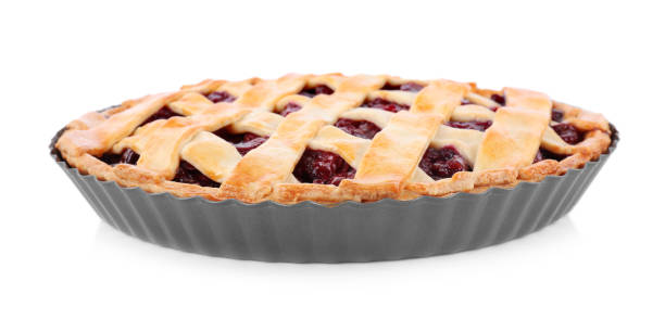 istock Delicious fresh cherry pie in baking dish isolated on white 1356126365