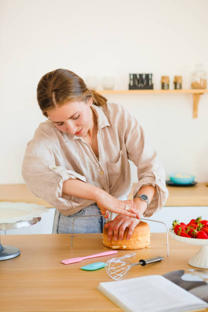 A pastry chef bakes a cake in the home kitchen. Home business.
