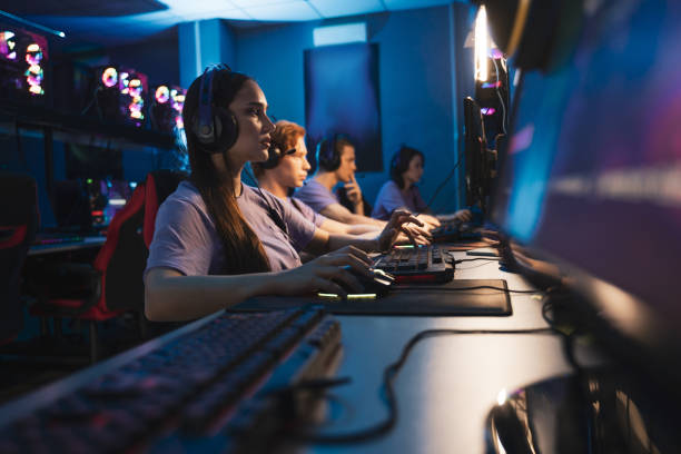 istock Cyber sport gamers playing game with RGB keyboard and mouse while sitting 1356129457