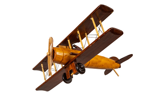 Toy wooden airplane isolated on white.