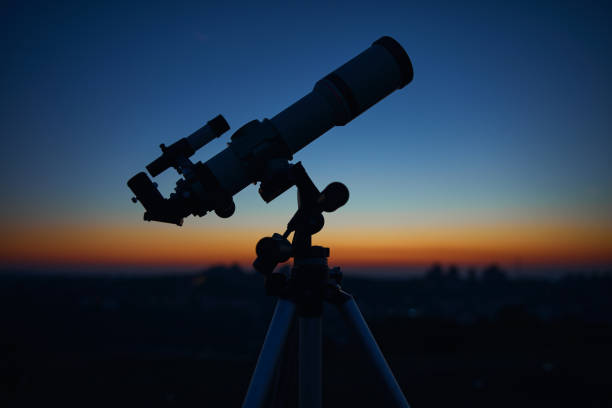 istock Astronomical telescope under a twilight sky ready for stargazing. 1356136493