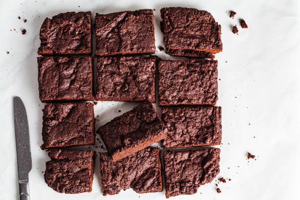 istock Vegan brownie squares on a white table. 1356136529
