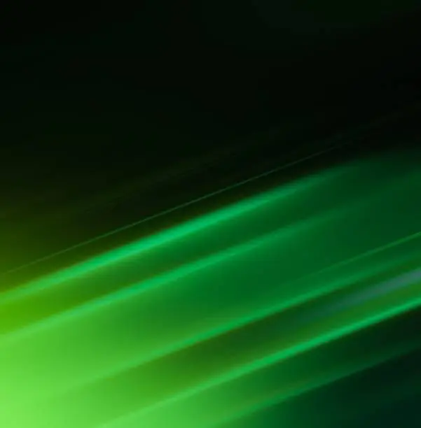 Photo of Abstract gradient green motion blur slanted lines fluorescent light trails background banner
