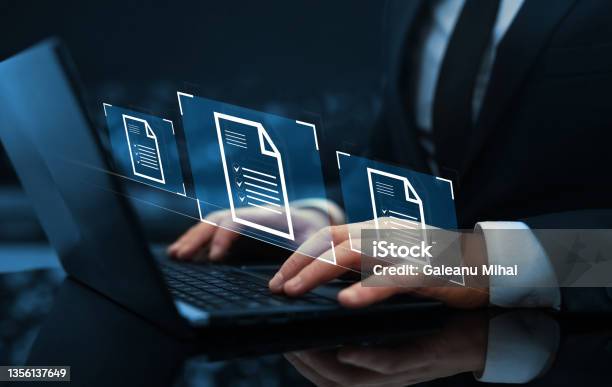 Businessman Working At Laptop Computer And Digital Documents With Checkbox Lists Law Regulation And Compliance Rules On Virtual Screen Concept Stock Photo - Download Image Now