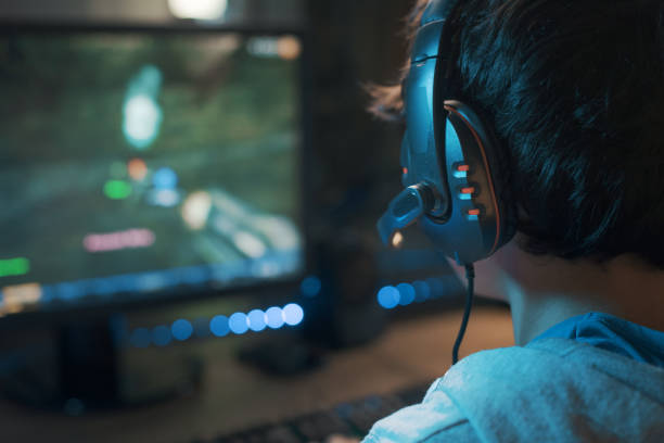 istock Young gamer playing online video games 1356138771