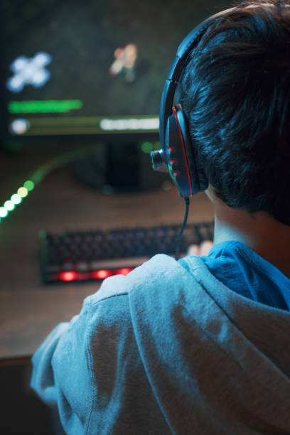 istock Young gamer playing online video games 1356138803