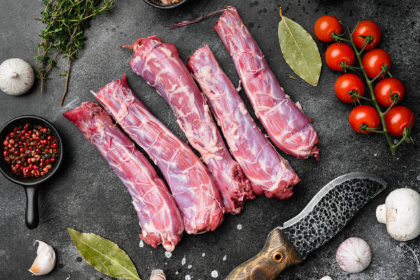 istock Raw turkey neck without skin, on black dark stone table background, top view flat lay 1356139202