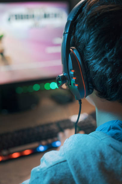 istock Young gamer playing online video games 1356139884