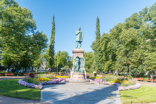 Helsinki, Finland - August 5, 2021: Statue of Johan Ludvig Runeberg, the national poet of Finland, at Esplanadi park avenue.