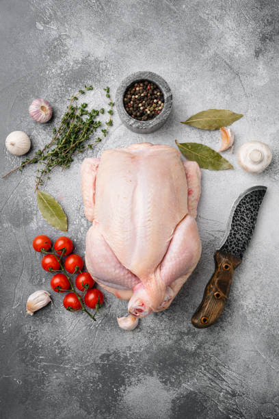 istock Whole chicken, on gray stone table background, top view flat lay 1356140483