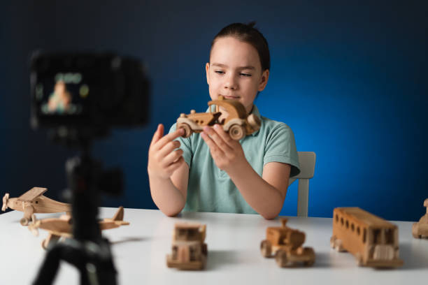 istock Young boy video blogger making stream with his followers. 1356141442