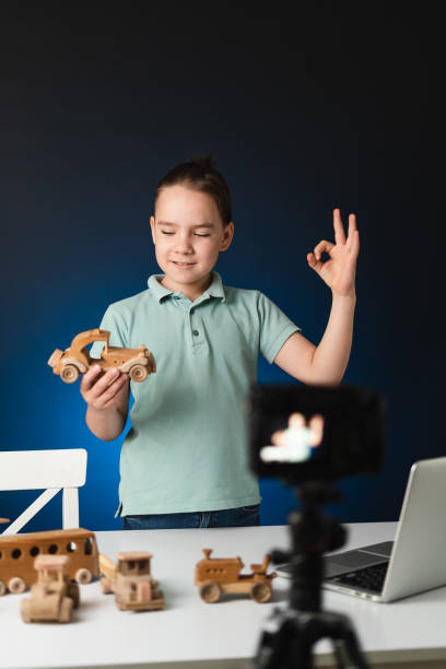 istock Young boy video blogger making stream with his followers. 1356141907