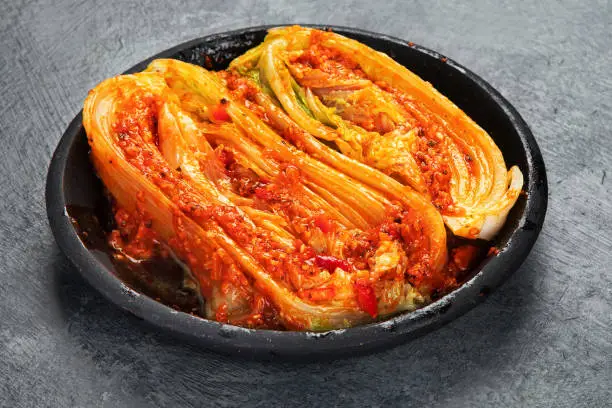 Kimchi cabbage on gray background. Traditional Korean food. copy space