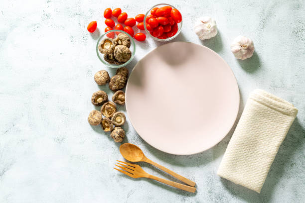 istock Empty white plate on gray concrete stone background. Top view, copy space 1356147570