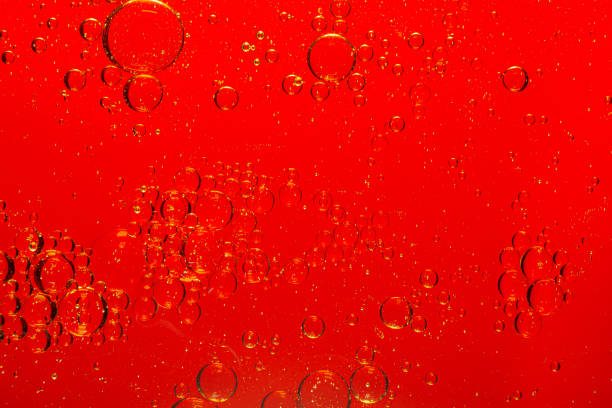 istock red macro bubbles,Backgrounds, Abstract Backgrounds, Soda, Red, Carbonated,Beauty concept background. Closeup cosmetic liquid gel with bubbles on red colors background 1356147636