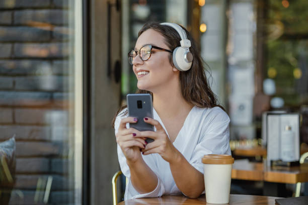 istock Enjoying leisure time and listening to music 1356148024