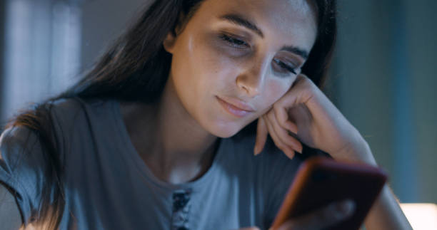 istock Young woman using her smartphone 1356148614