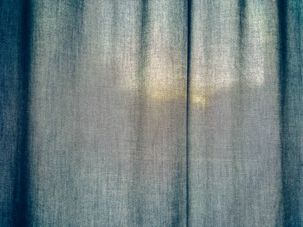 istock A dark fabric with the sun in the background. 1356148650