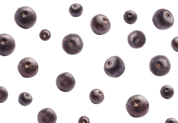 Fresh acai berries falling on white background Fresh acai berries falling on white background superfruit stock pictures, royalty-free photos & images