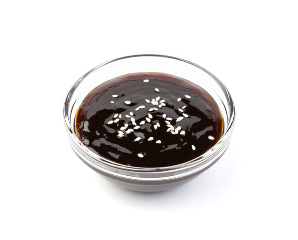 istock Teriyaki sauce with sesame seeds isolated on a white background 1356149638