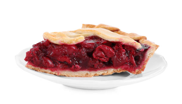 istock Slice of delicious fresh cherry pie isolated on white 1356150247