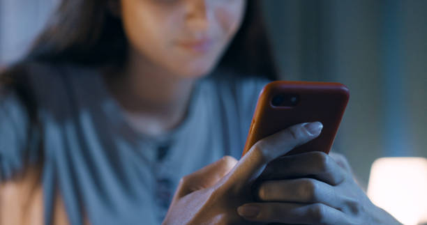 istock Young woman using her smartphone 1356150394