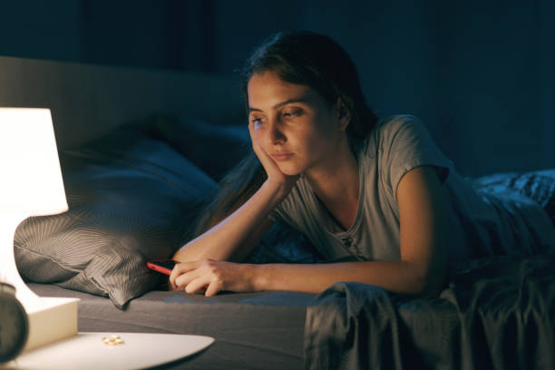 istock Sad woman suffering from insomnia 1356150499